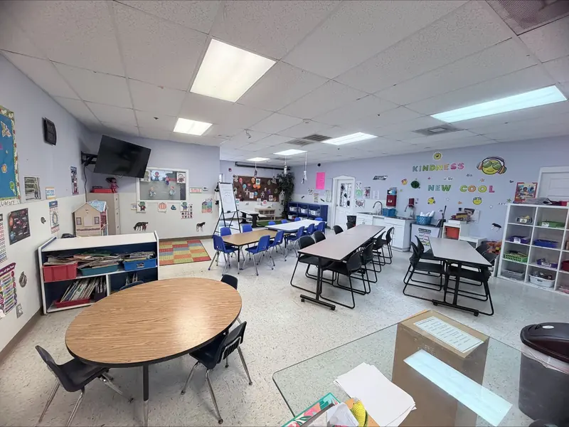 After-school room with activity tables and learning displays