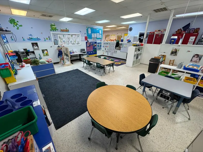 After-school classroom with games and supply shelves